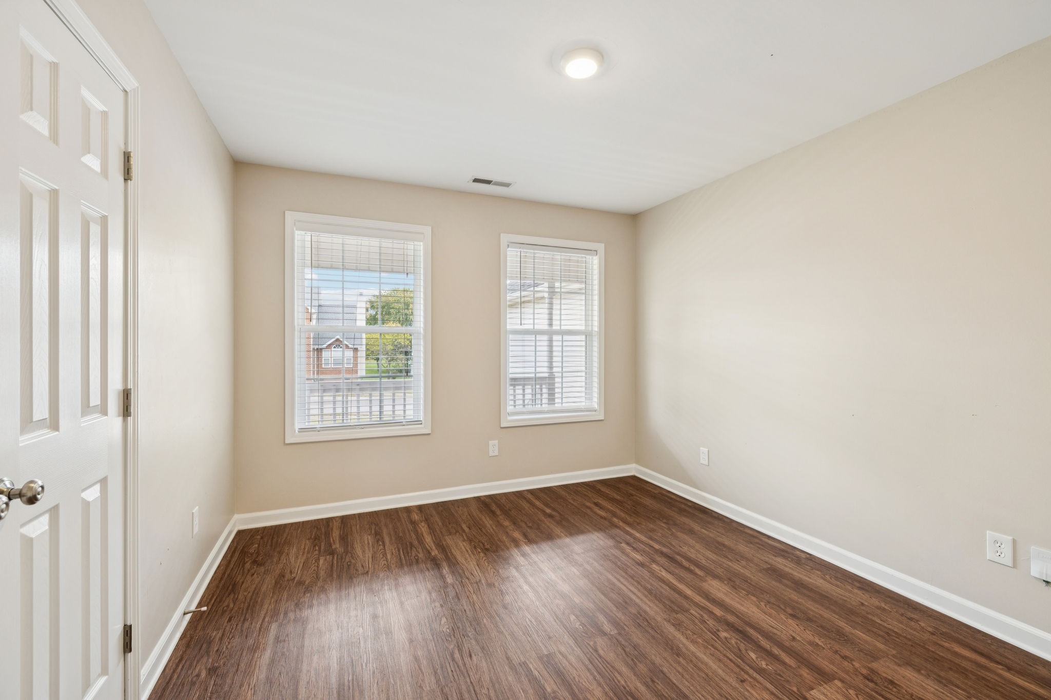 1305 Chapman Court Spring Hill, TN 37174 - Photo 33 of 53 a view of an empty room with wooden floor and a window