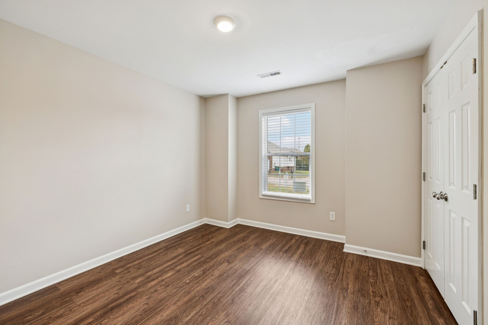 1305 Chapman Court Spring Hill, TN 37174 - Photo 35 of 53 an empty room with wooden floor and windows