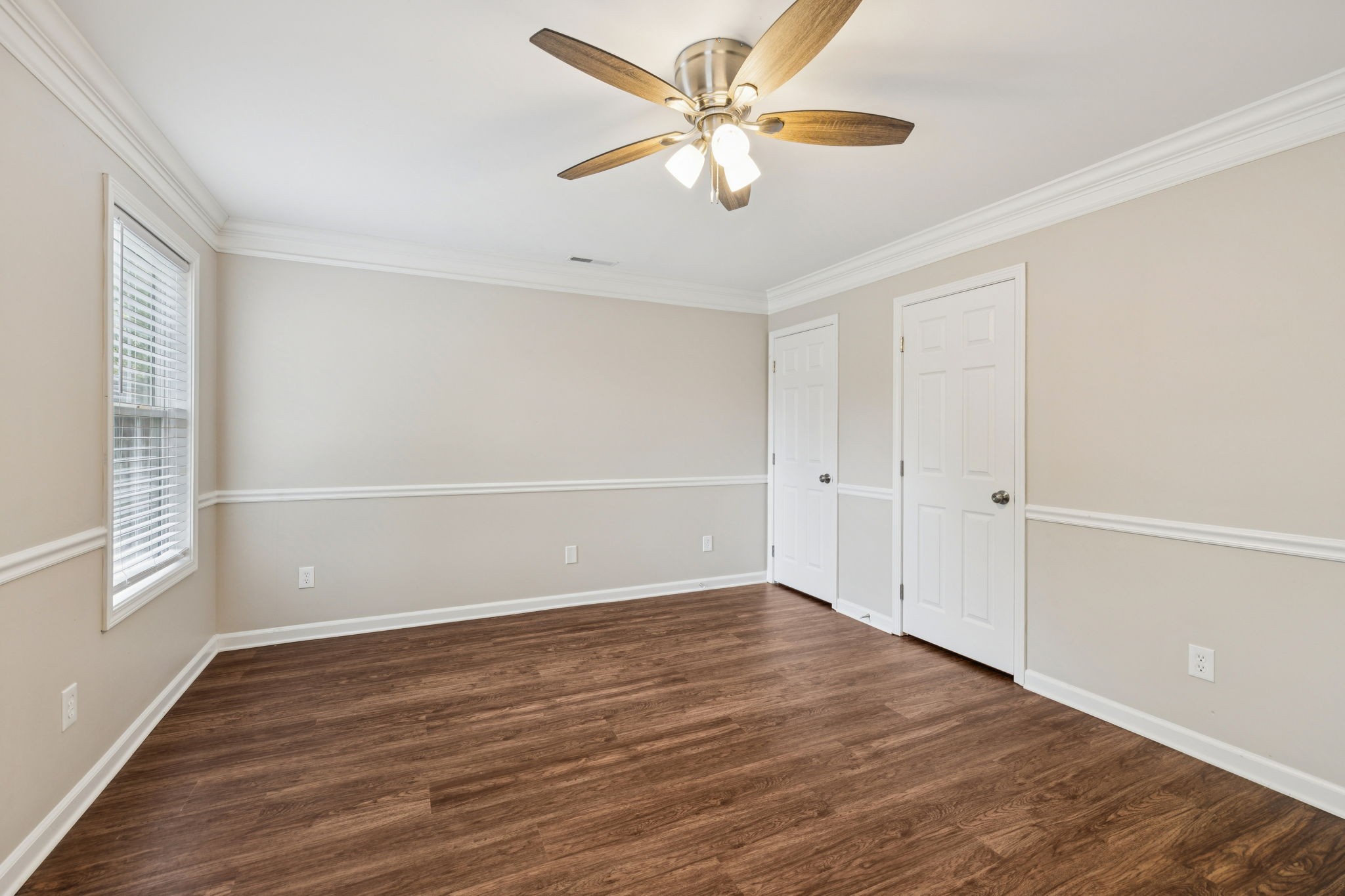 1305 Chapman Court Spring Hill, TN 37174 - Photo 38 of 53 an empty room with wooden floor fan and windows