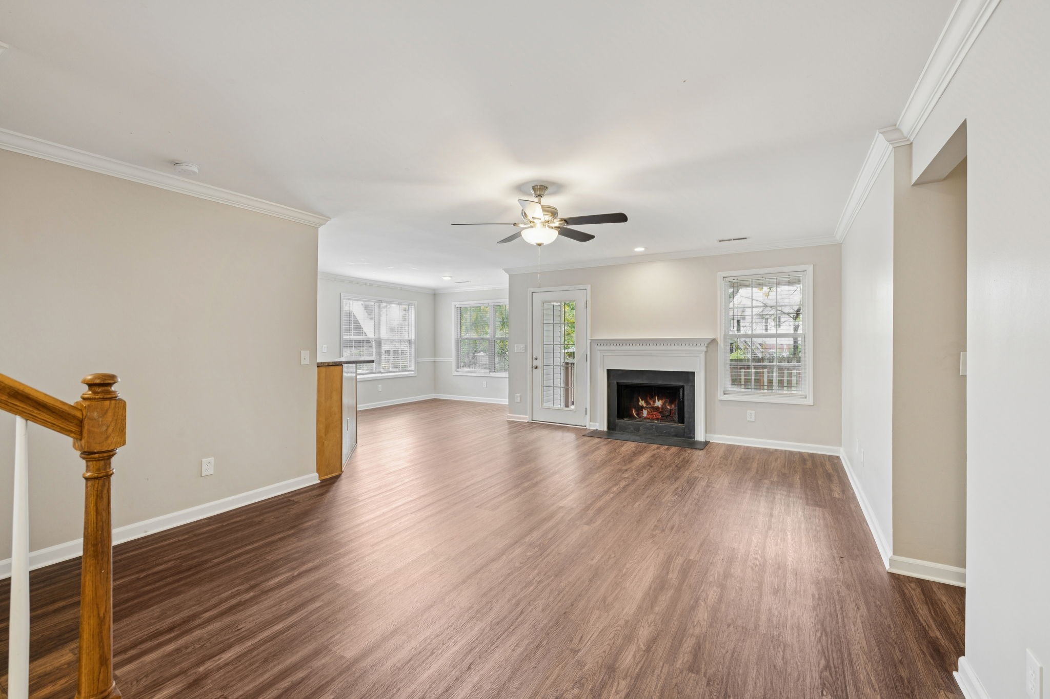 1305 Chapman Court Spring Hill, TN 37174 - Photo 8 of 53 a view of an empty room with wooden floor fireplace and a window