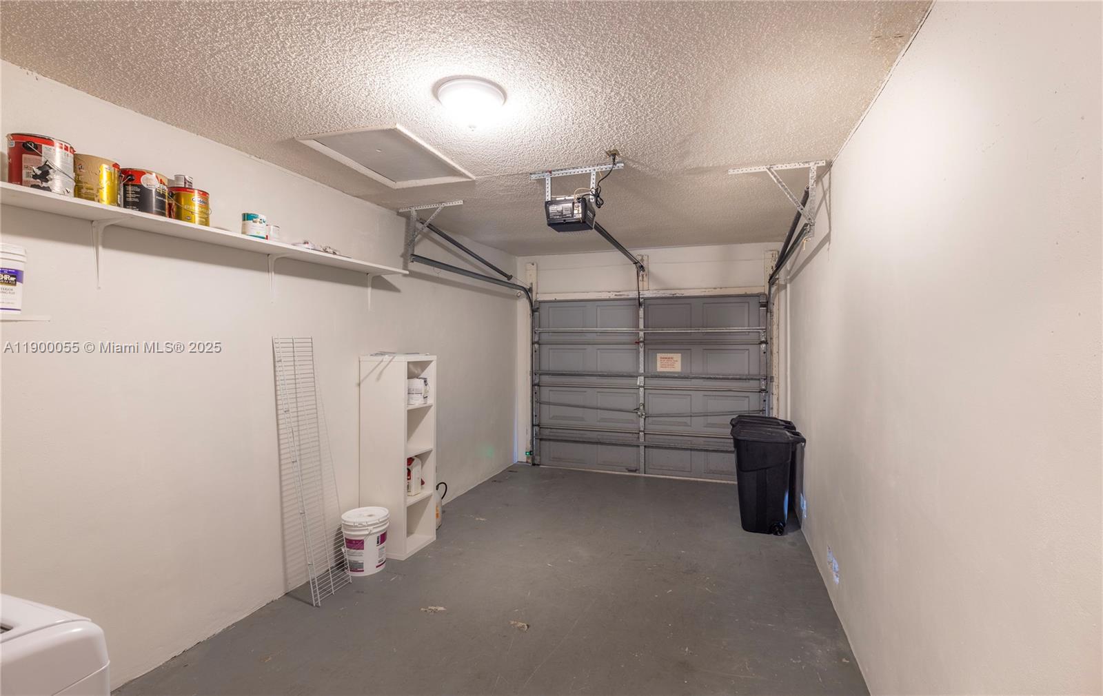 14237 Southwest 94th Cir Lane, Unit 101 Miami, FL 33186 - Photo 4 of 34 a view of walk in closet with empty racks