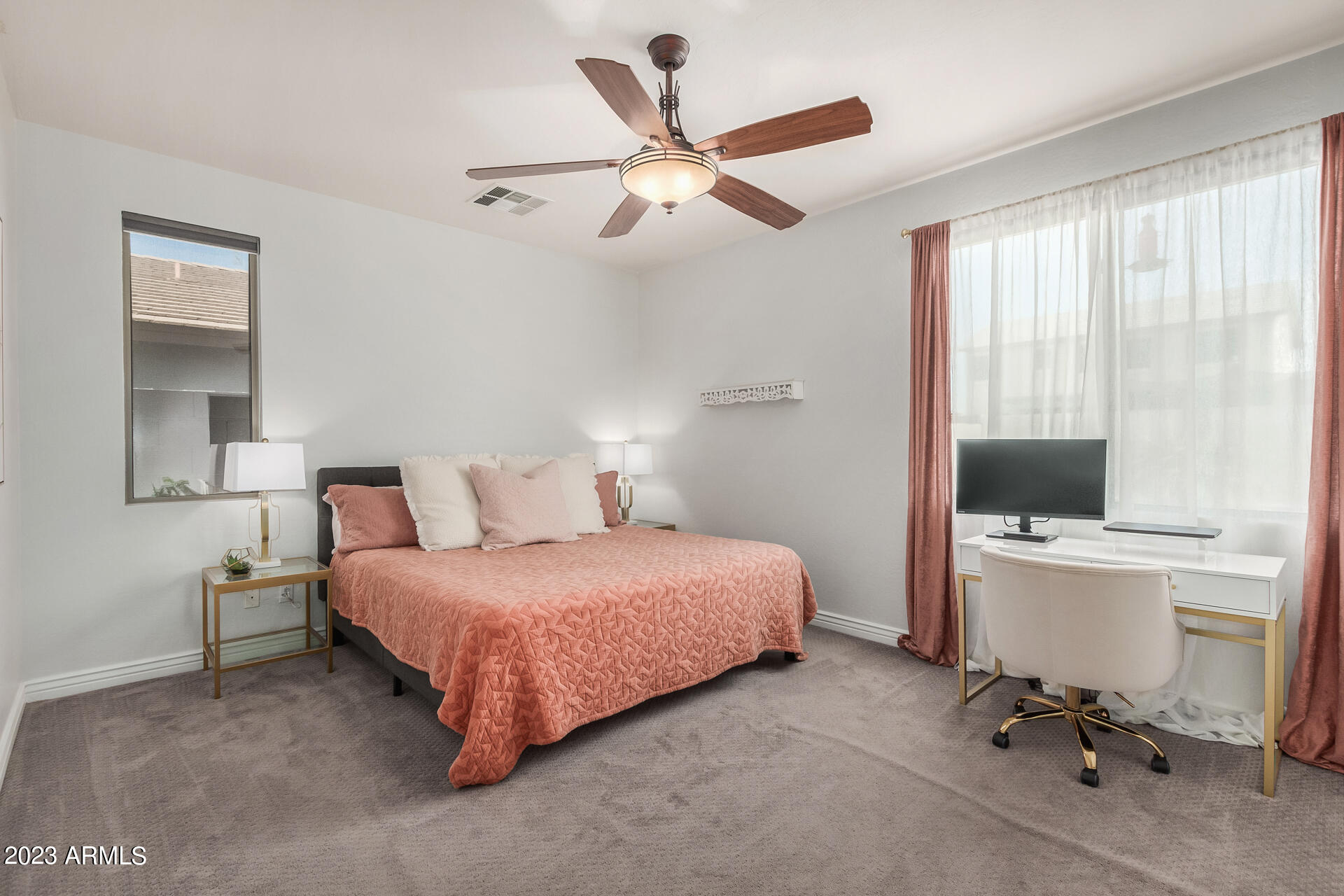 17560 West E Wind Avenue Goodyear, AZ 85338 - Photo 11 of 30 a bedroom with a bed and a large window