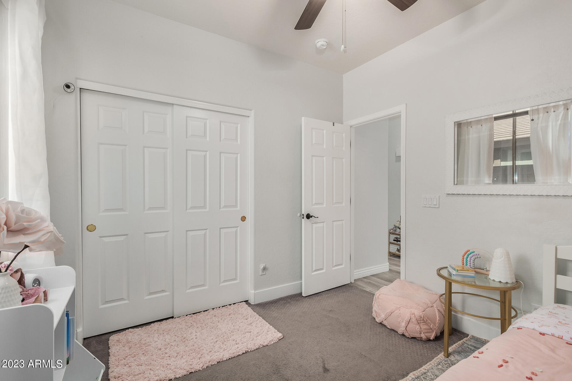 17560 West E Wind Avenue Goodyear, AZ 85338 - Photo 15 of 30 a bedroom with furniture and a window