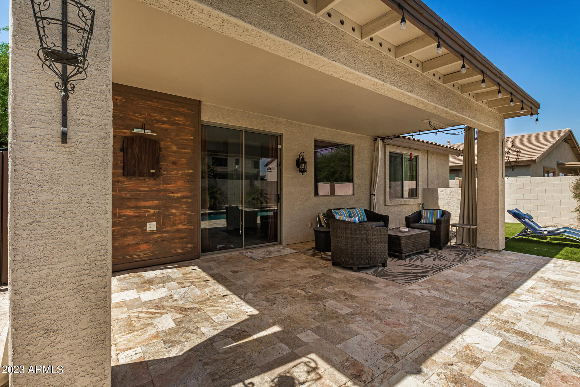 17560 West E Wind Avenue Goodyear, AZ 85338 - Photo 20 of 30 a living room with furniture and a flat screen tv