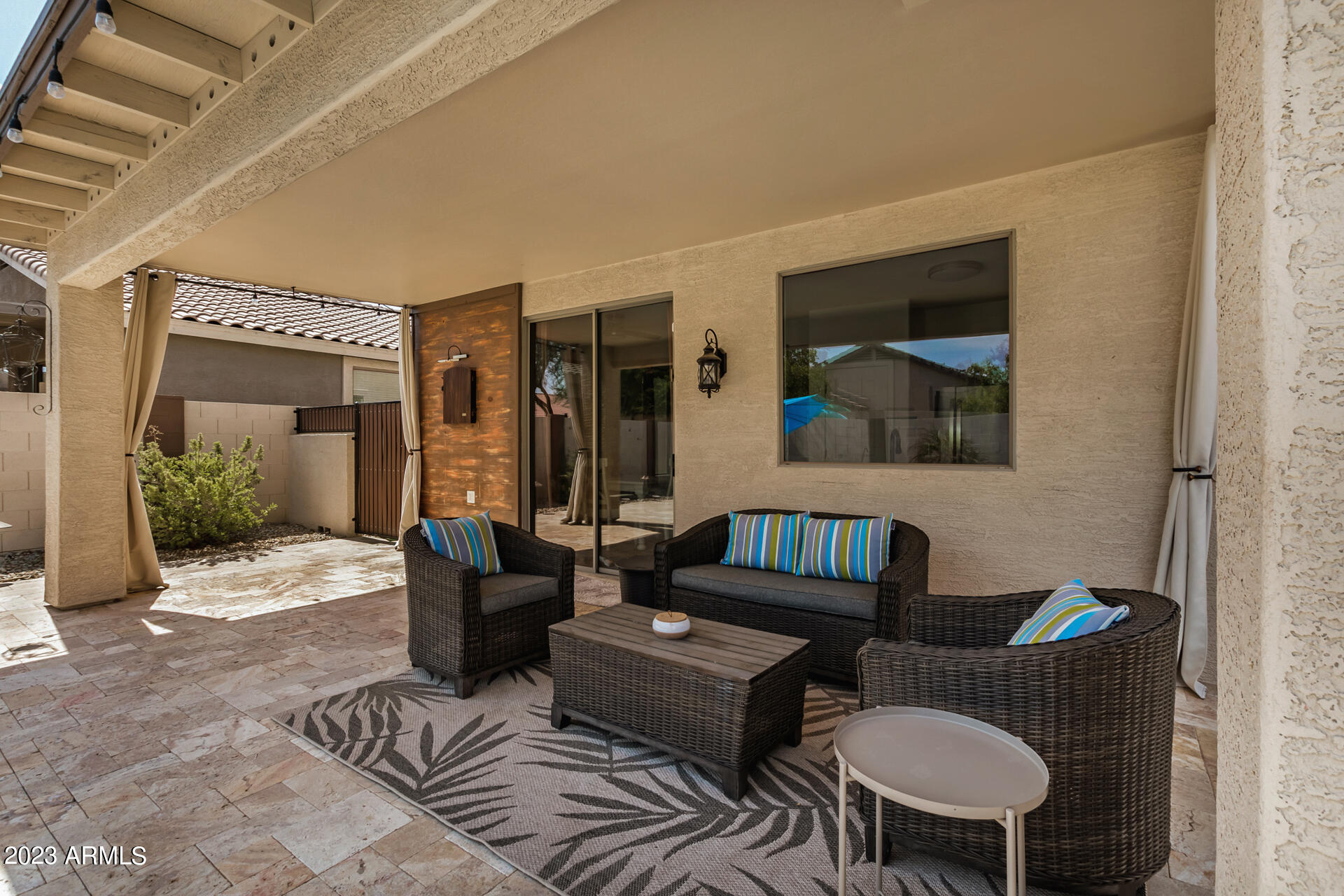 17560 West E Wind Avenue Goodyear, AZ 85338 - Photo 21 of 30 a living room with furniture and a potted plant
