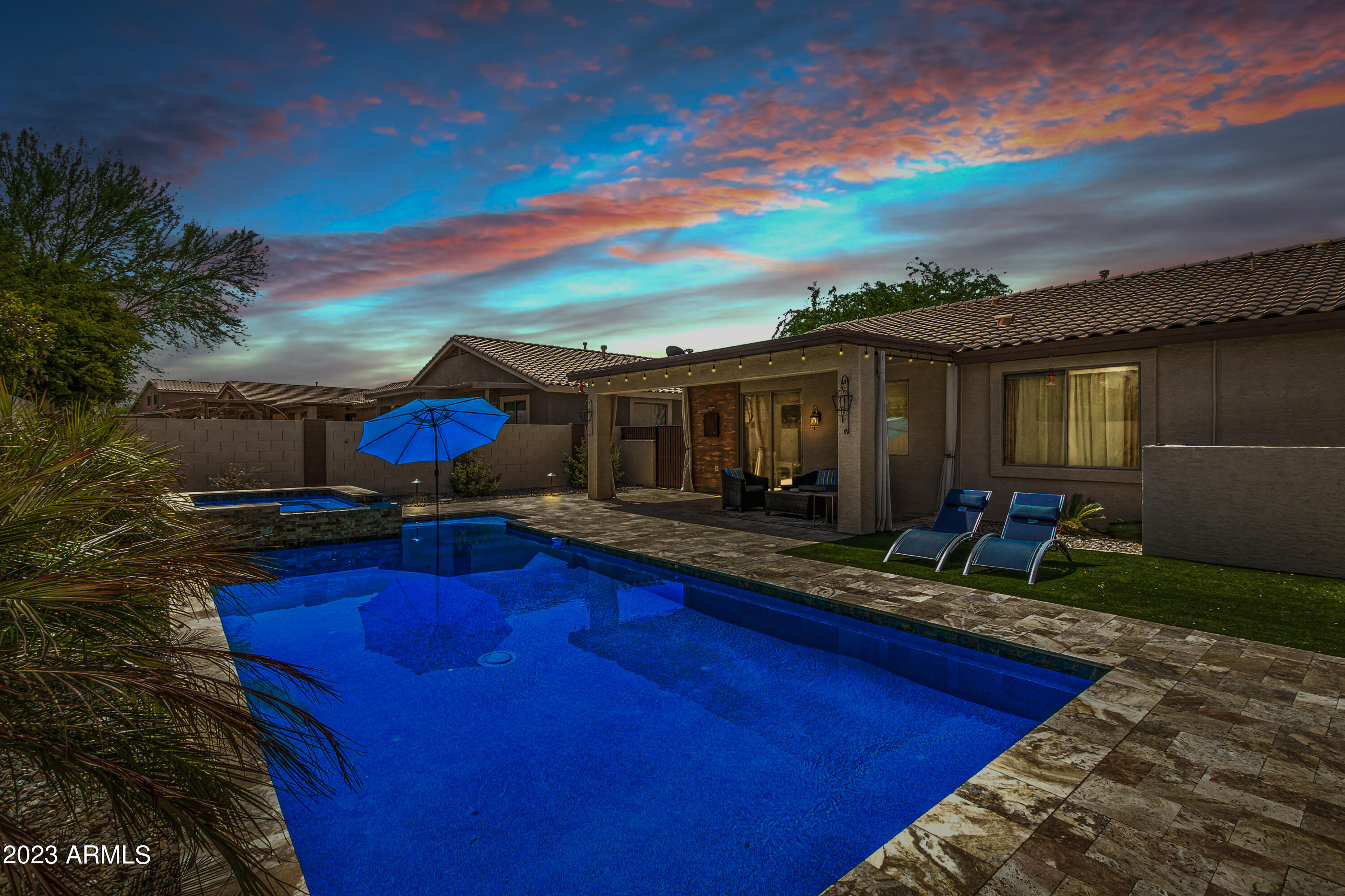 17560 West E Wind Avenue Goodyear, AZ 85338 - Photo 30 of 30 a view of house with backyard outdoor seating and kitchen