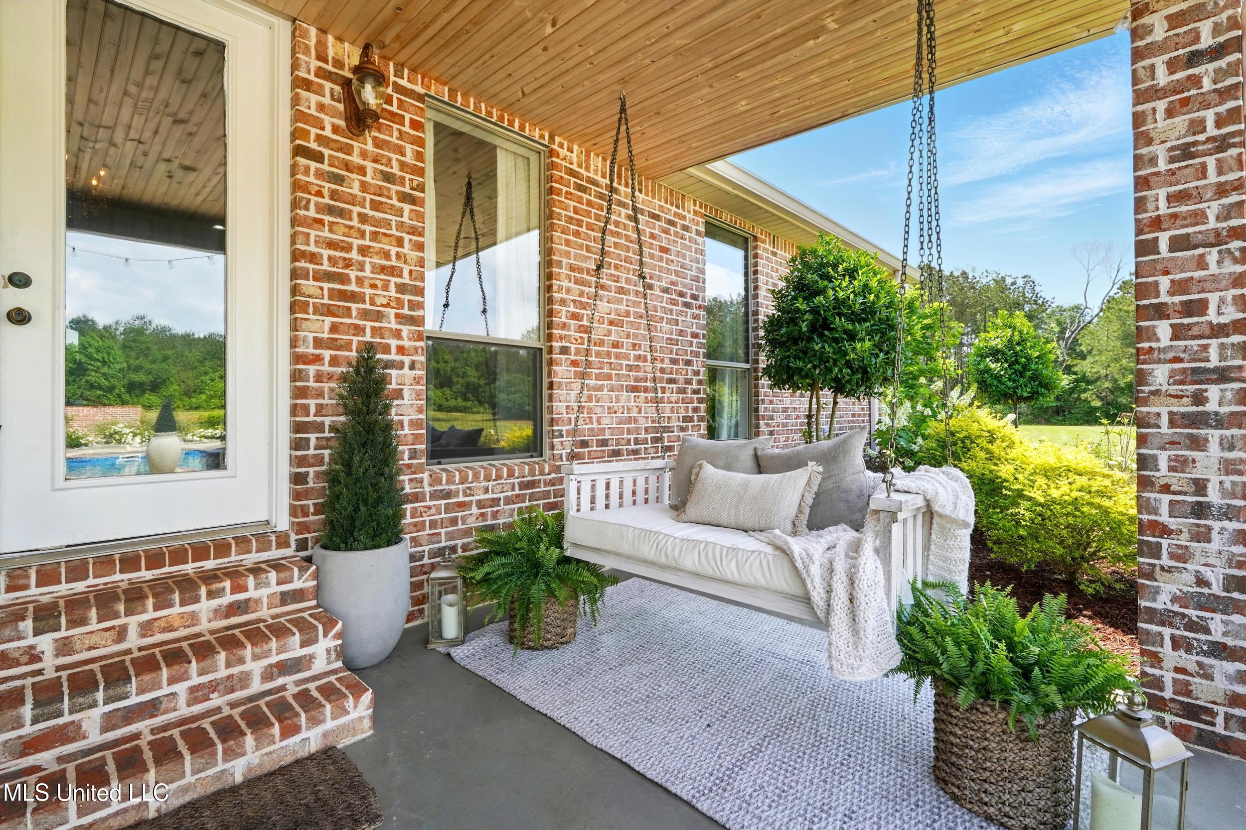 7 Jim Pearson Road Picayune, MS 39466 - Photo 32 of 46 33_outside porch swing