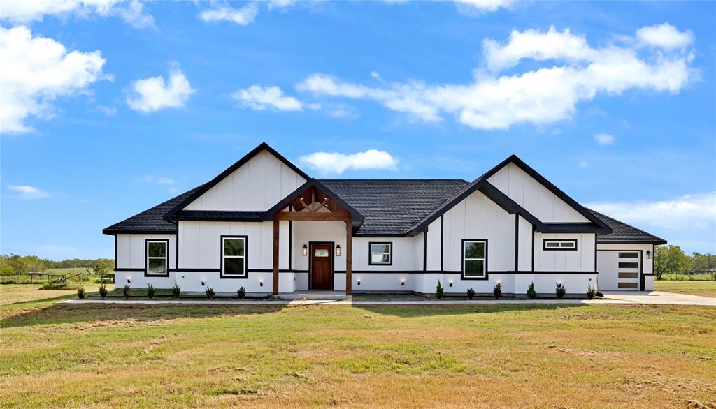 a view of a house with swimming pool and view of house