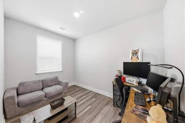 a bedroom with a bed and a tv on the table