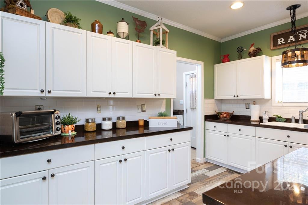 4016 Hoodtown Road Sharon, SC 29742 - Photo 13 of 32 a kitchen with white cabinets and window