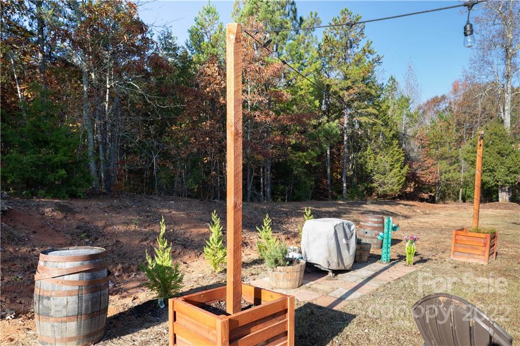 4016 Hoodtown Road Sharon, SC 29742 - Photo 8 of 32 a view of a patio with couches chairs and a potted plant