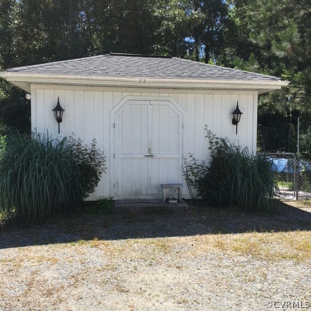 20100 Frog Level Road Ruther Glen, VA 22546 - Photo 6 of 6 a view of a white house with a small yard