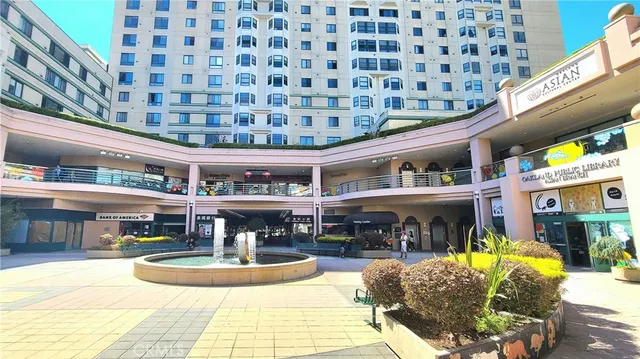 a view of a swimming pool with outdoor seating