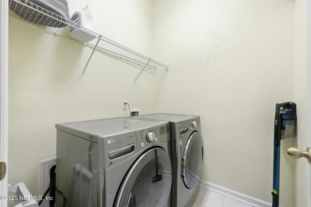 a utility room with dryer and washer