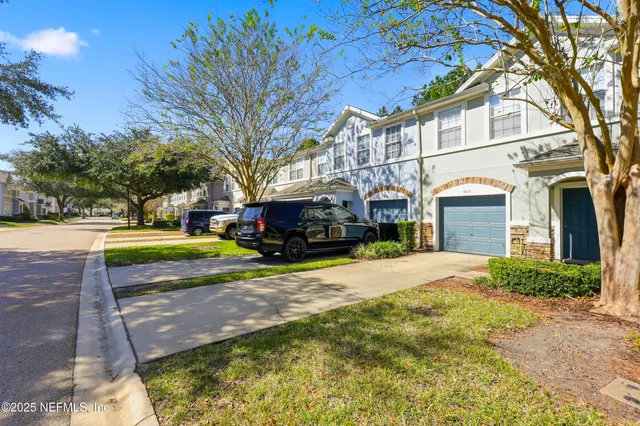 a view of a house with a yard