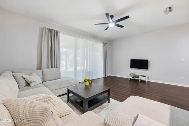 a living room with furniture and a window