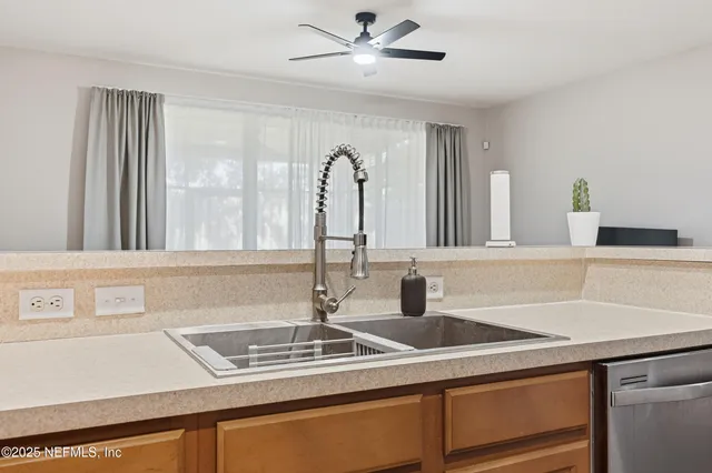 a kitchen with a sink and a window