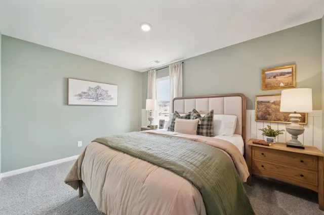 a bed room with a bed and a night stand