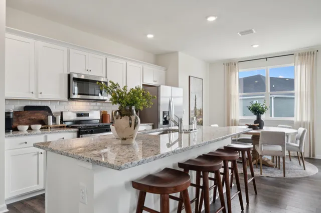a kitchen with sink and microwave