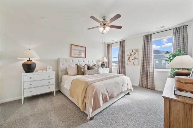 a bedroom with bed and window