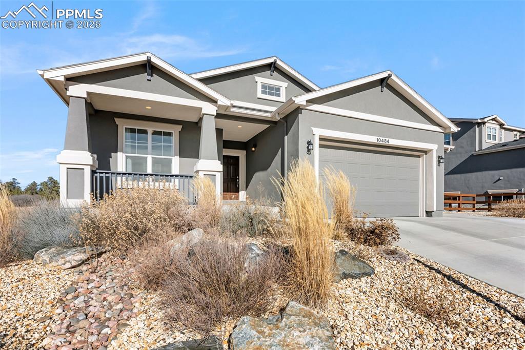 10484 Wrangell Circle Colorado Springs, CO 80924 - Photo 3 of 50 a front view of a house with garden