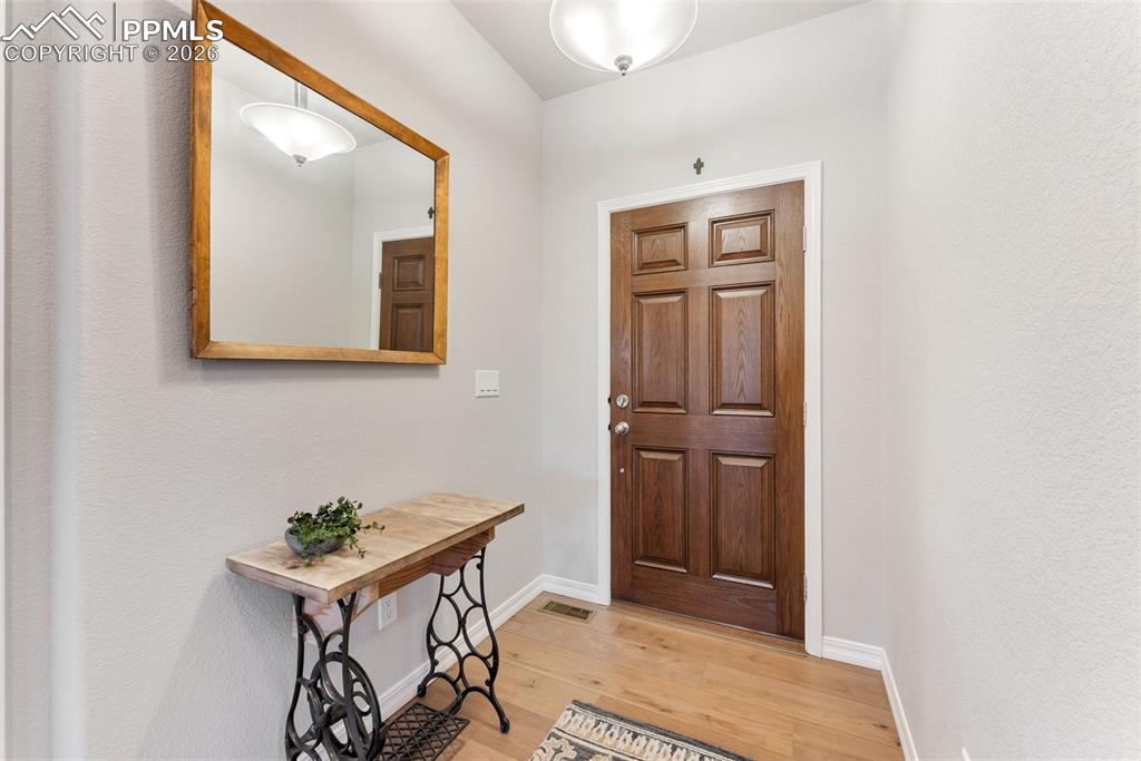 10484 Wrangell Circle Colorado Springs, CO 80924 - Photo 4 of 50 a view of entryway with wooden floor