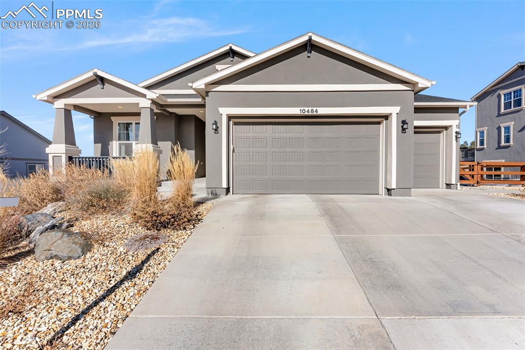10484 Wrangell Circle Colorado Springs, CO 80924 - Photo 44 of 50 a front view of a house with a yard and garage