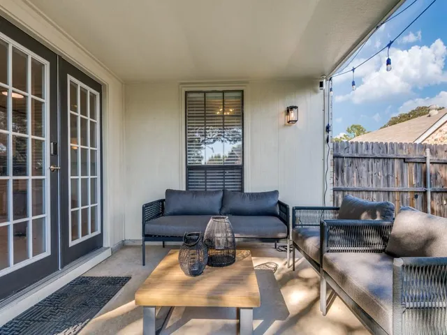 a wooden bench sitting in a grassy field