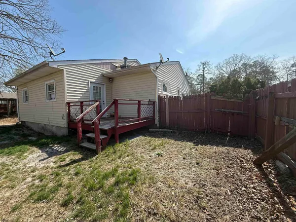 a view of a house with a yard and chair