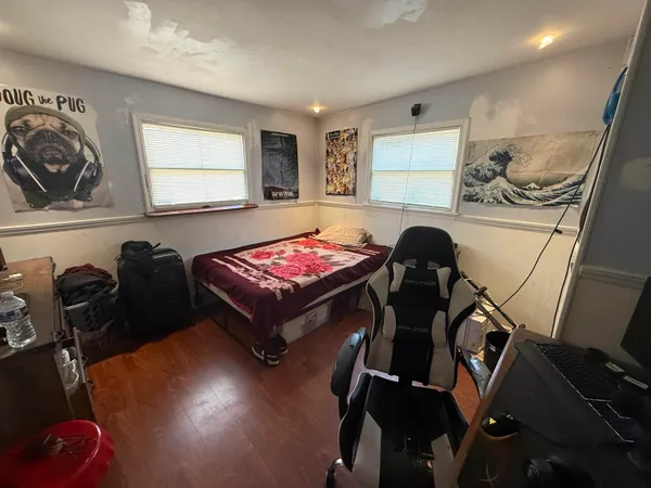 a room with gym equipment and a window
