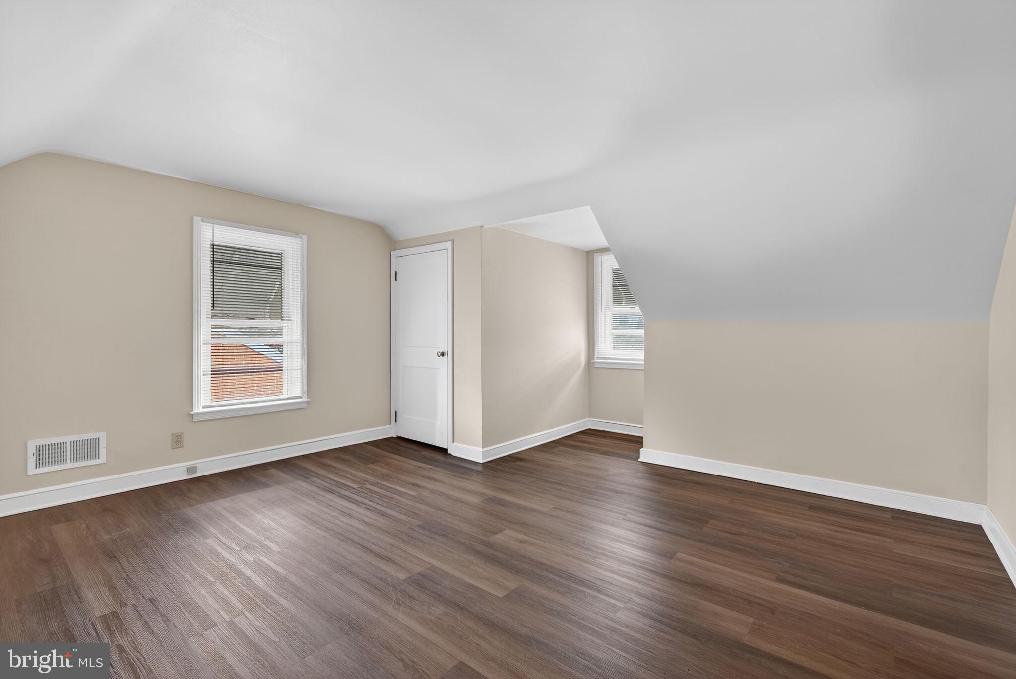 2527 North George Street York, PA 17406 - Photo 18 of 24 a view of an empty room with wooden floor and a window