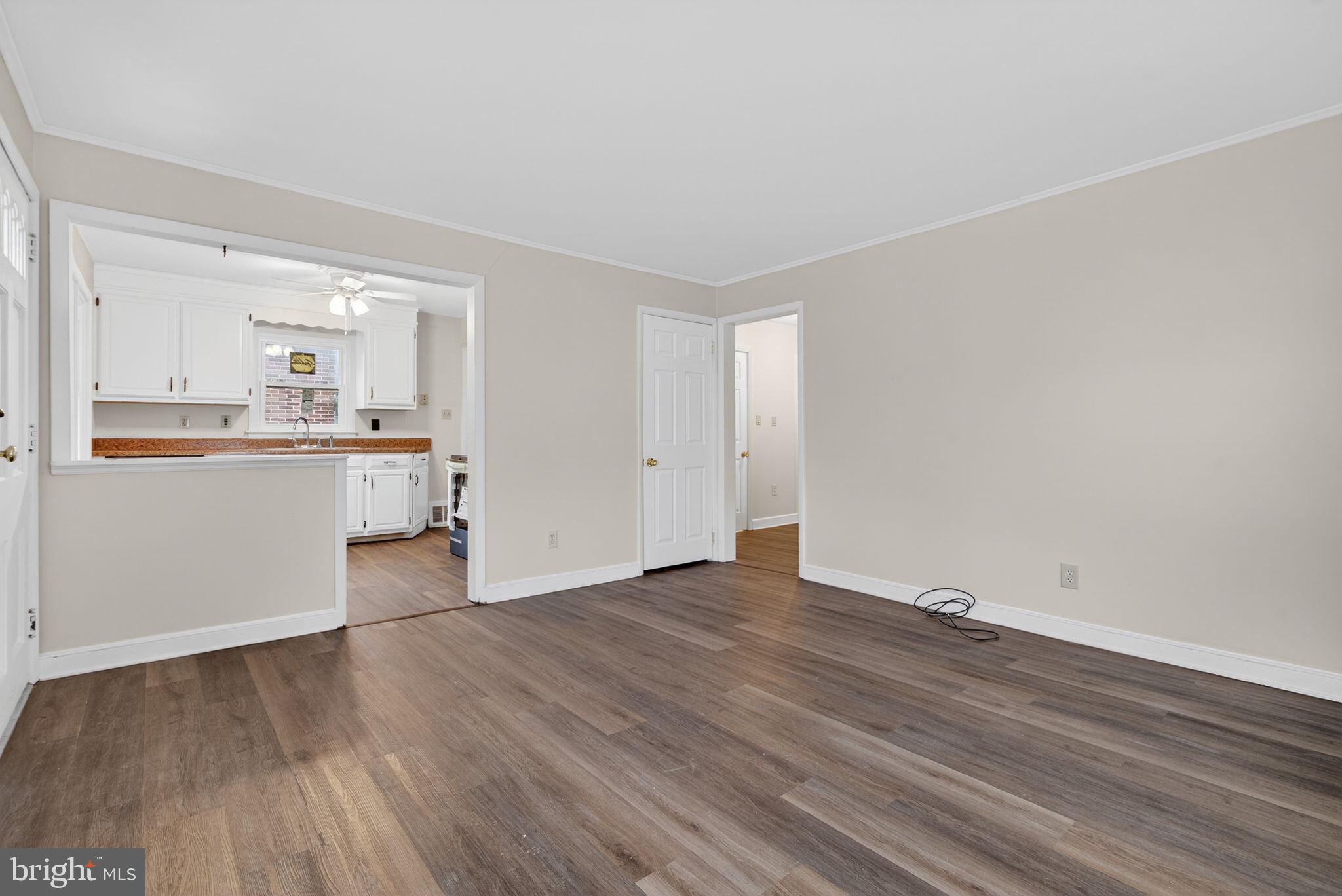 2527 North George Street York, PA 17406 - Photo 6 of 24 a view of a kitchen with wooden floor and a sink