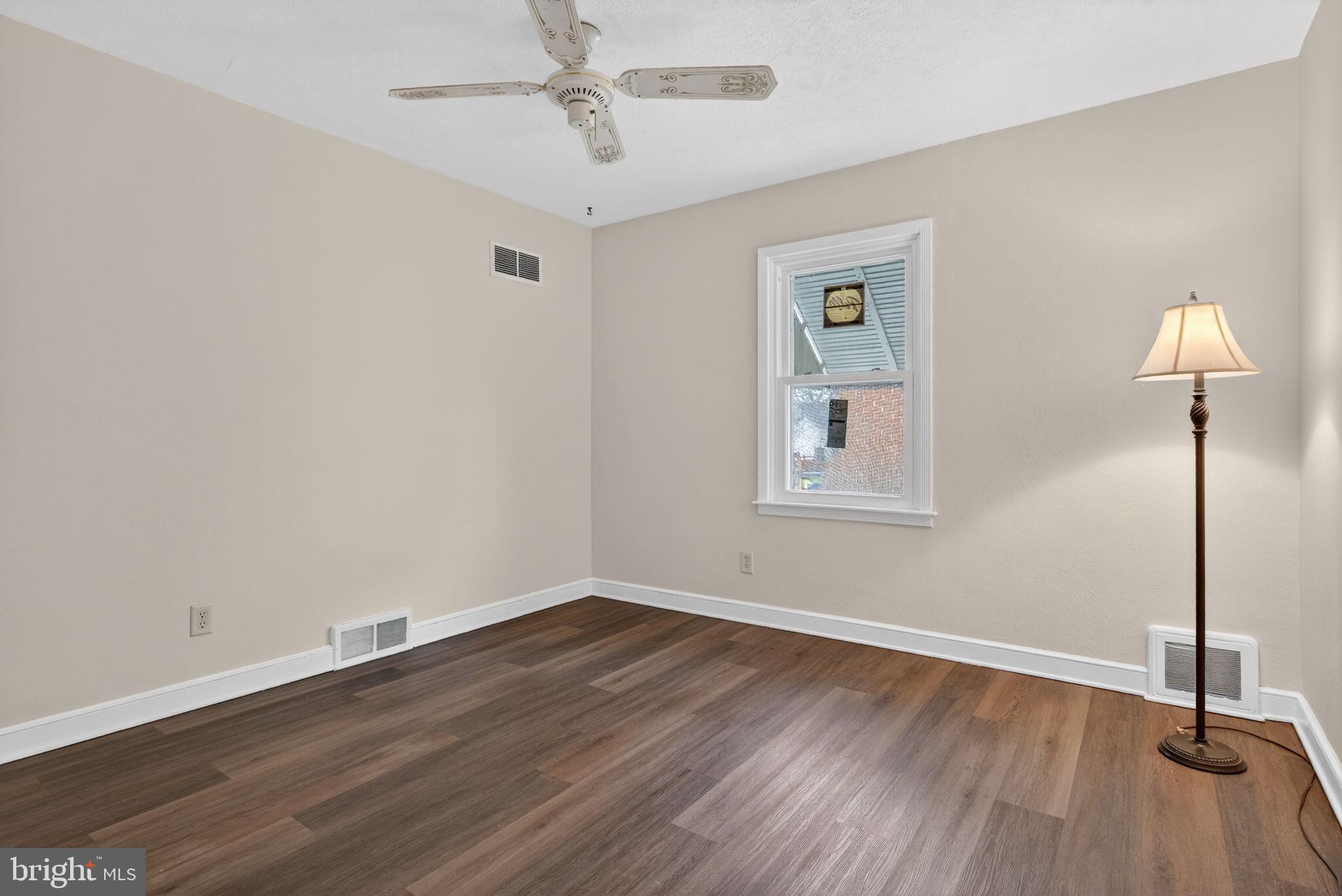 2527 North George Street York, PA 17406 - Photo 10 of 24 a view of a room with wooden floor closet and windows