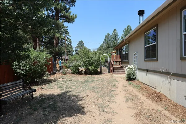 a kitchen with stainless steel appliances granite countertop a stove a sink dishwasher and a refrigerator