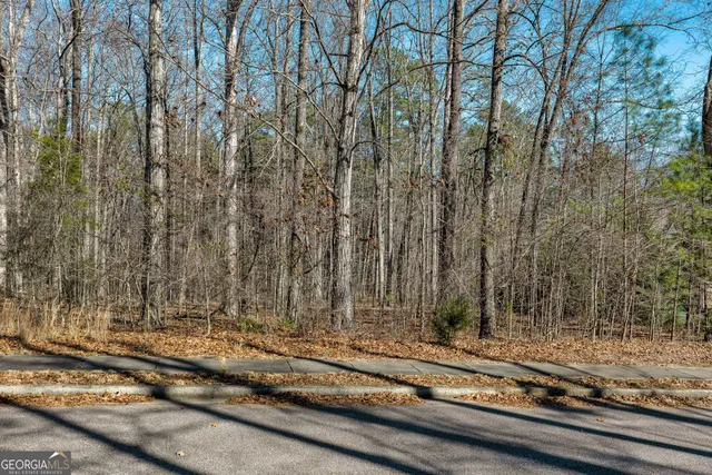 a view of rooftop house with yard and seating