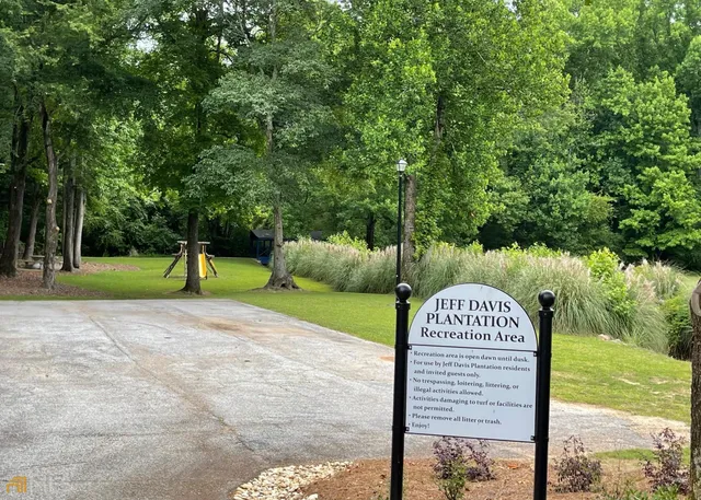 a house with trees in the background