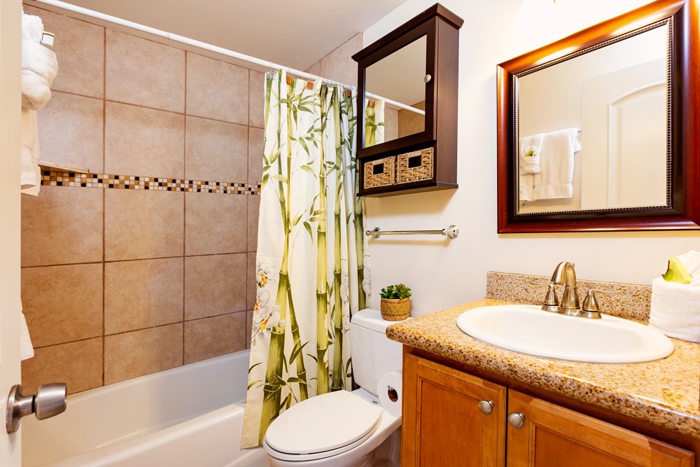 115 North Kihei Road, Unit B1 Kihei, HI 96753 - Photo 11 of 29 a bathroom with a sink a toilet and shower