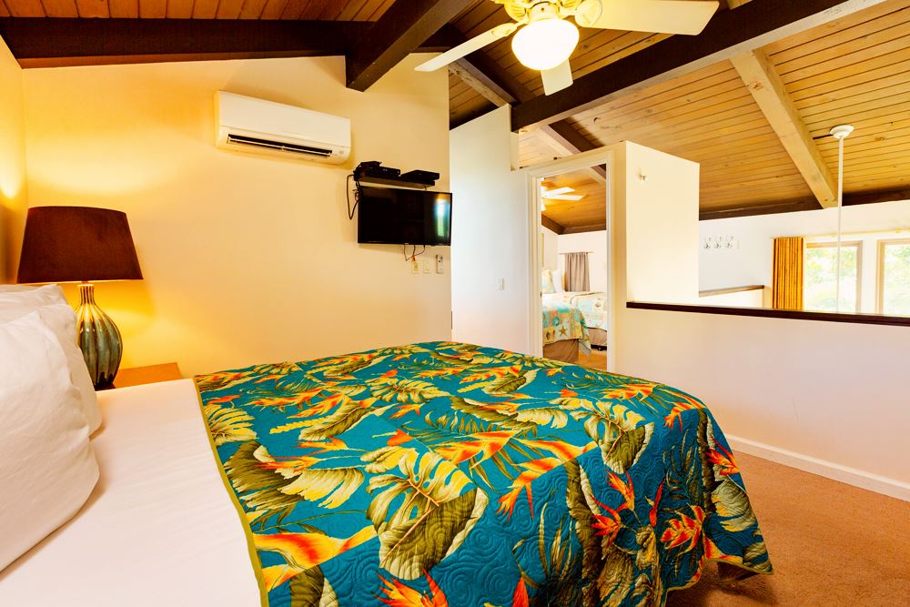 115 North Kihei Road, Unit B1 Kihei, HI 96753 - Photo 13 of 29 a bedroom with a bed and a flat tv screen on dresser