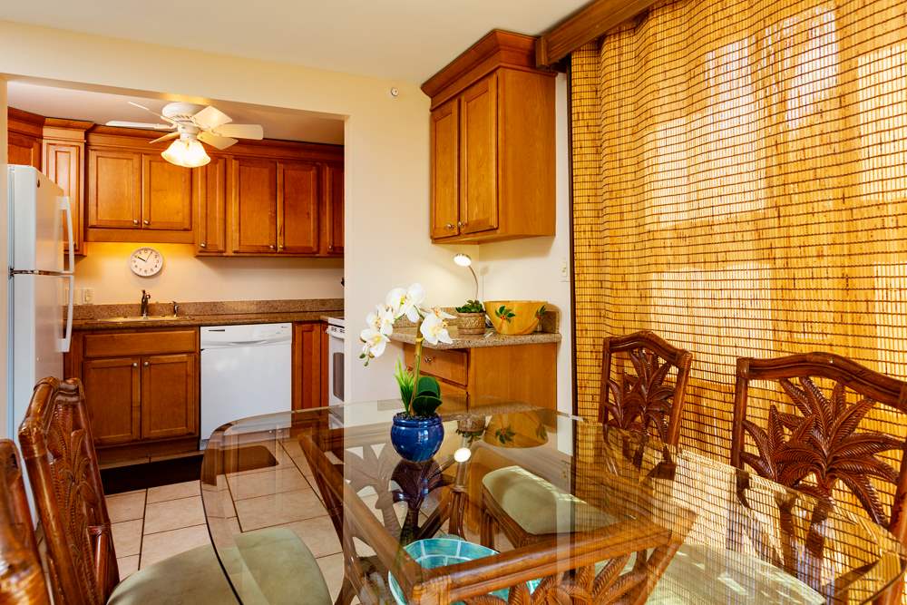 115 North Kihei Road, Unit B1 Kihei, HI 96753 - Photo 24 of 29 a kitchen with a sink and cabinets