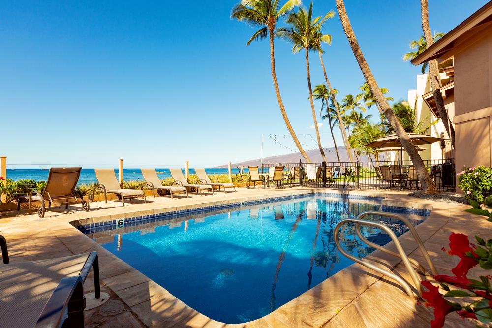 115 North Kihei Road, Unit B1 Kihei, HI 96753 - Photo 4 of 29 a view of a swimming pool with lounge chairs