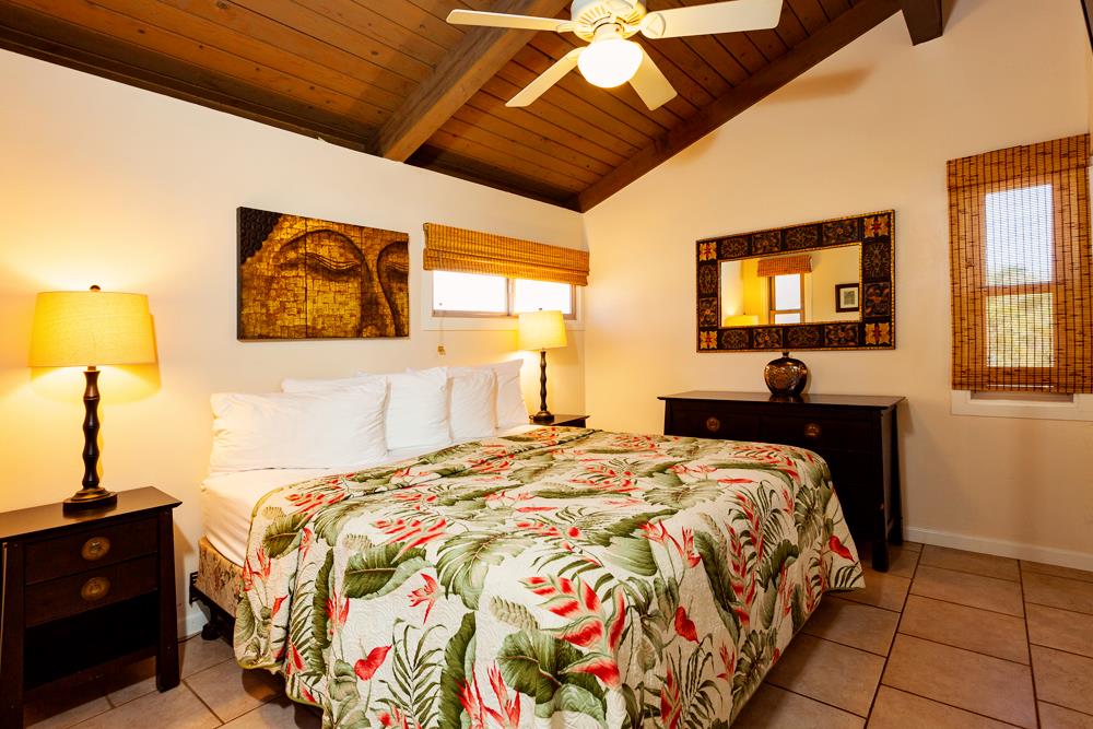 115 North Kihei Road, Unit B1 Kihei, HI 96753 - Photo 10 of 29 a bedroom with a bed and wooden floor