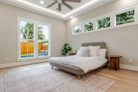 a spacious bedroom with a bed and a window