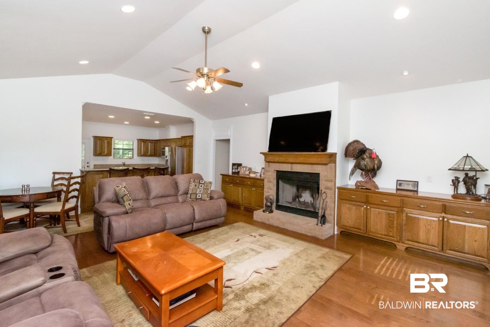 1360 Dykes Road North Mobile, AL 36608 - Photo 4 of 40 Living room with vaulted ceiling, light wood-type flooring, a fireplace, recessed lighting, and ceiling fan