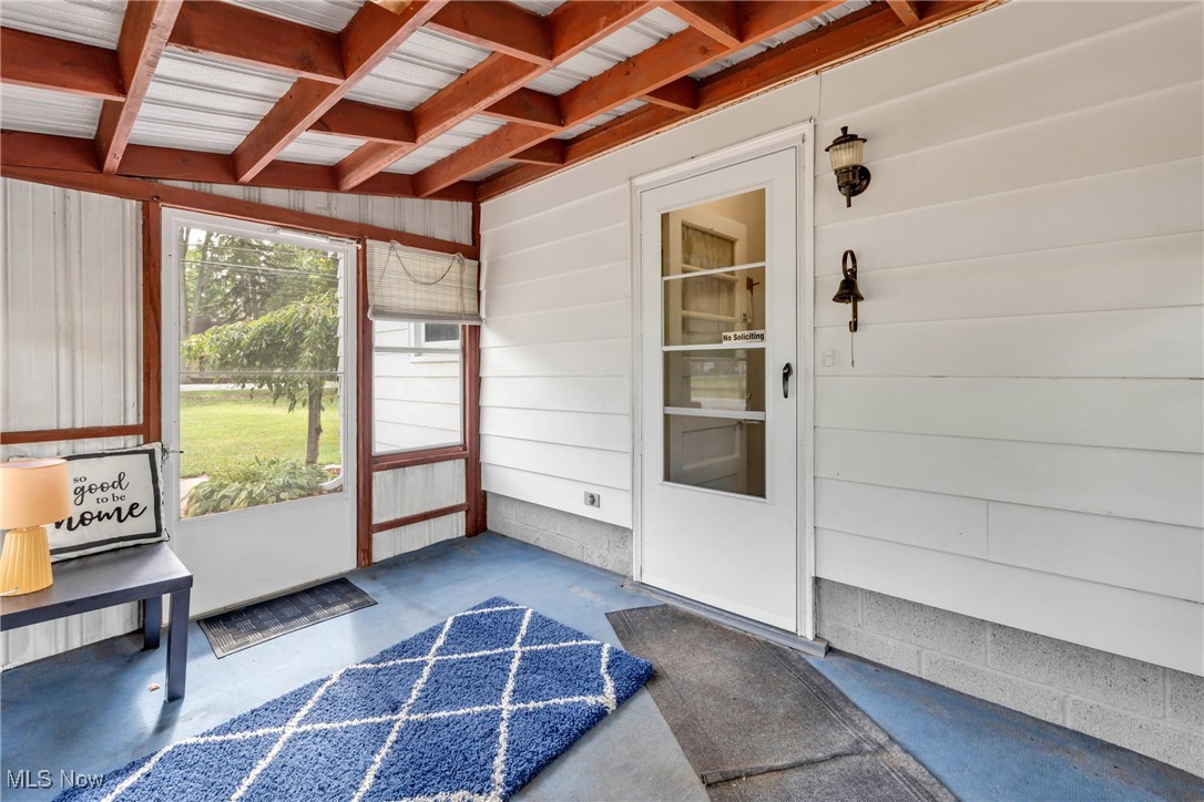 390 Hilliard Road Elyria, OH 44035 - Photo 7 of 30 Unfurnished sunroom with beamed ceiling
