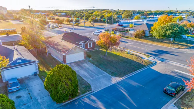 a view of a balcony with wooden floor