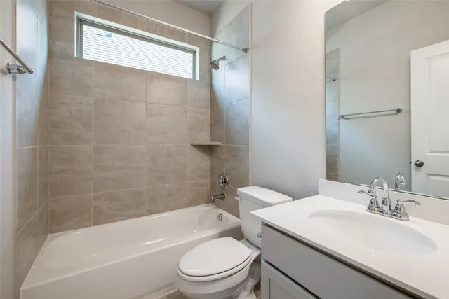 a bathroom with a toilet a sink and a bathtub