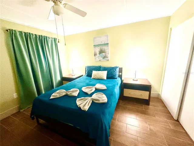 a bedroom with a bed and a mirror