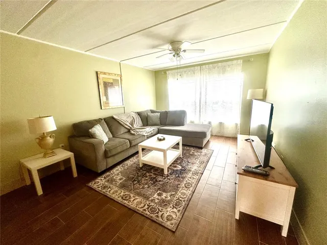 a living room with furniture and a window