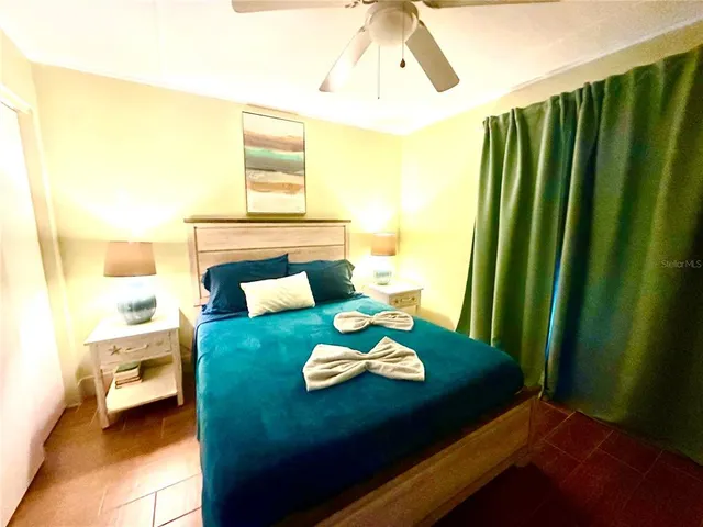 a view of a dining room with furniture and a window