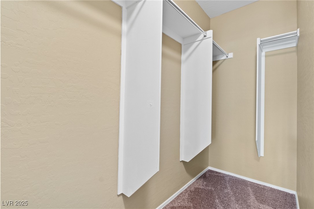 4705 Apulia Drive, Unit 103 North Las Vegas, NV 89084 - Photo 10 of 23 Walk in closet with carpet